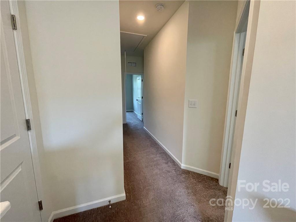 715 Swift Run Tega Cay, SC 29708 - Photo 11 of 24 a view of a hallway with closet