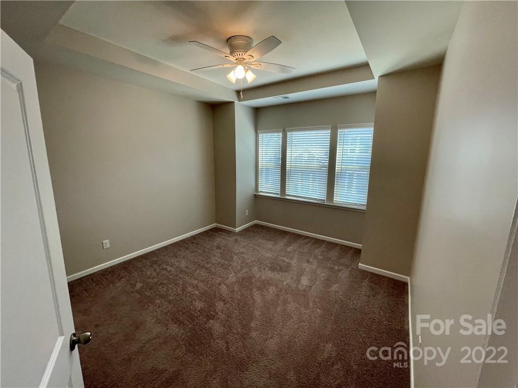 715 Swift Run Tega Cay, SC 29708 - Photo 13 of 24 an empty room with windows and fan