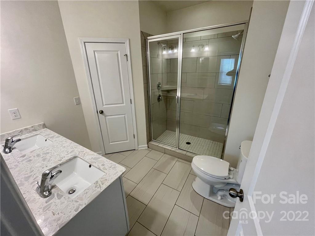 715 Swift Run Tega Cay, SC 29708 - Photo 15 of 24 a bathroom with a sink toilet and shower