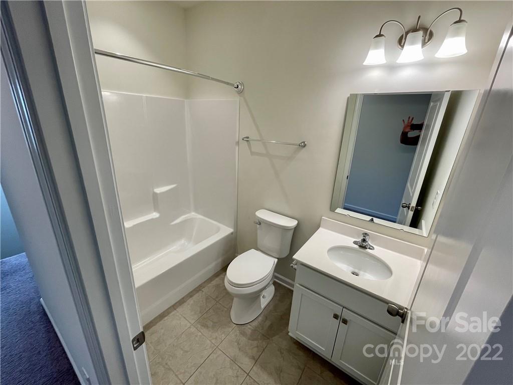 715 Swift Run Tega Cay, SC 29708 - Photo 17 of 24 a bathroom with a sink toilet and shower