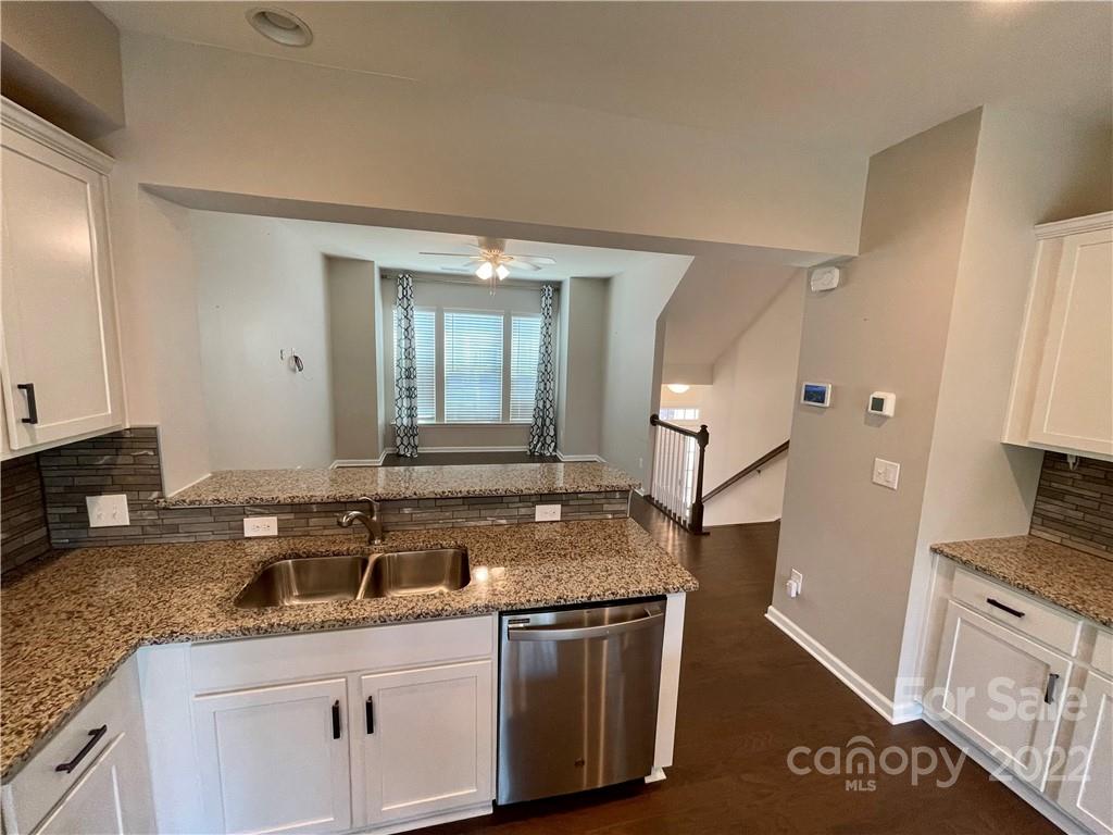 715 Swift Run Tega Cay, SC 29708 - Photo 2 of 24 a kitchen with a sink stove and cabinets