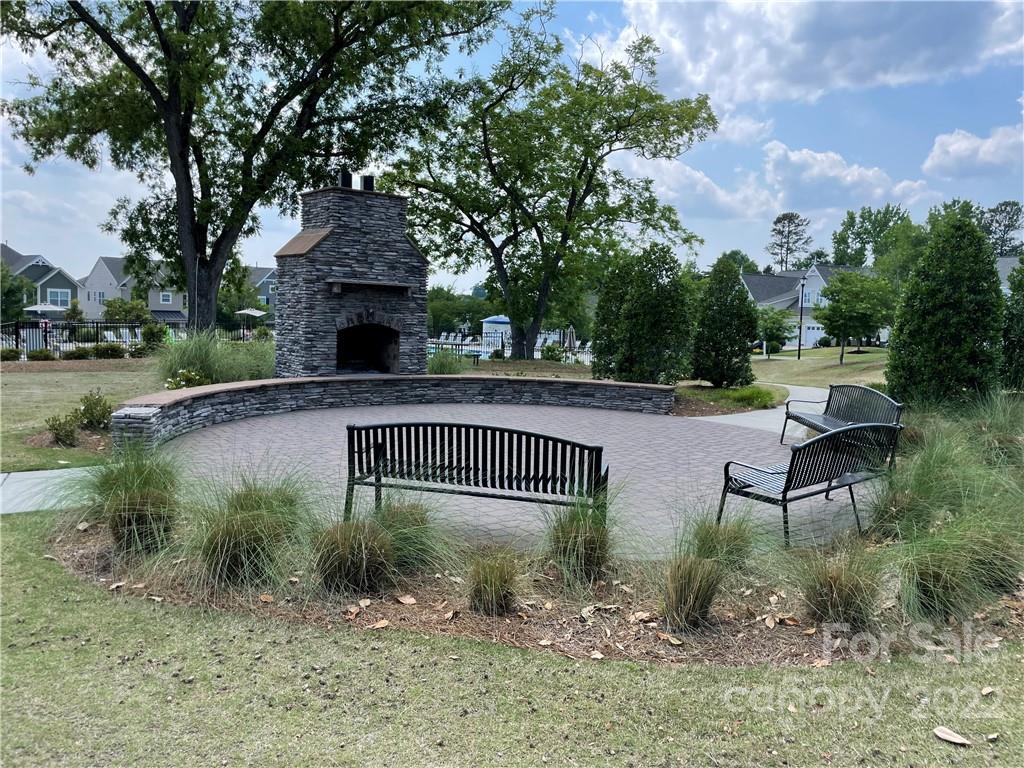 715 Swift Run Tega Cay, SC 29708 - Photo 22 of 24 a view of a chair and table in the yard