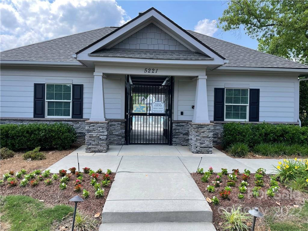 715 Swift Run Tega Cay, SC 29708 - Photo 23 of 24 a front view of a house with a flower garden