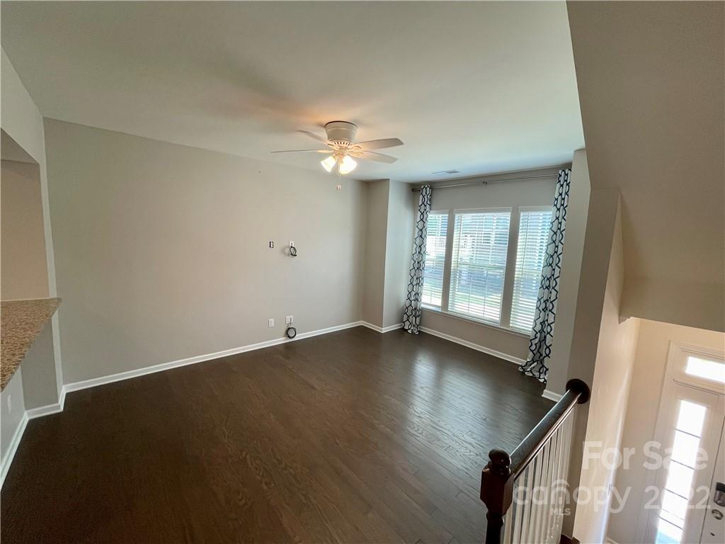 715 Swift Run Tega Cay, SC 29708 - Photo 3 of 24 wooden floor in an empty room with a window