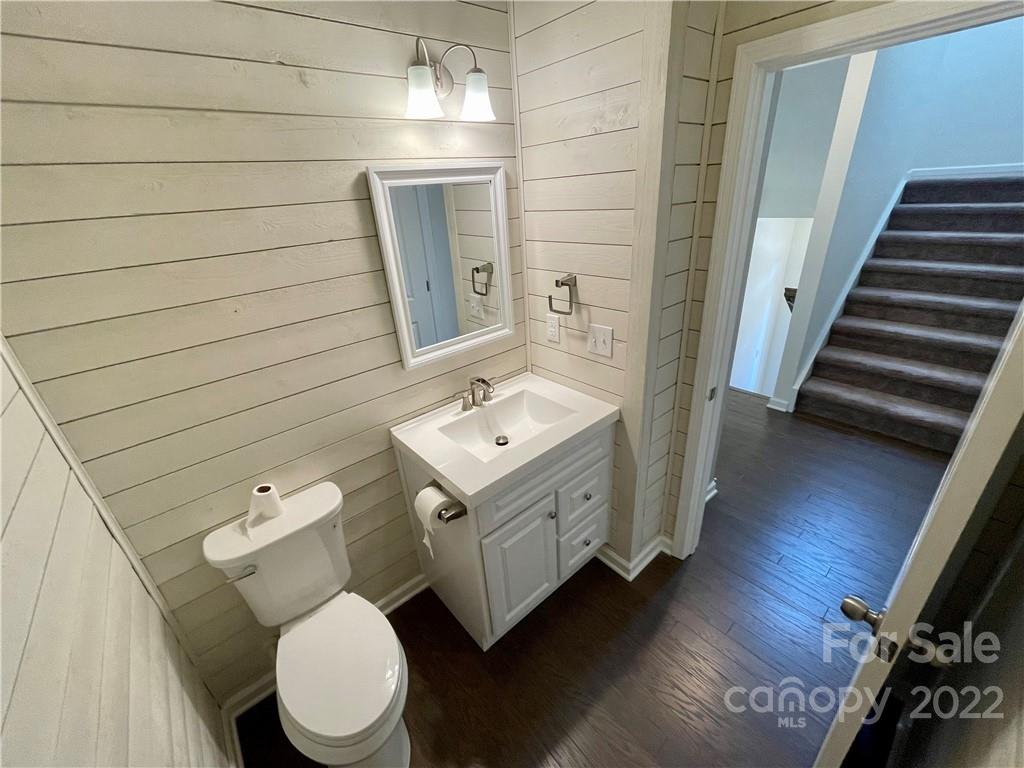 715 Swift Run Tega Cay, SC 29708 - Photo 10 of 24 a bathroom with a toilet sink and mirror