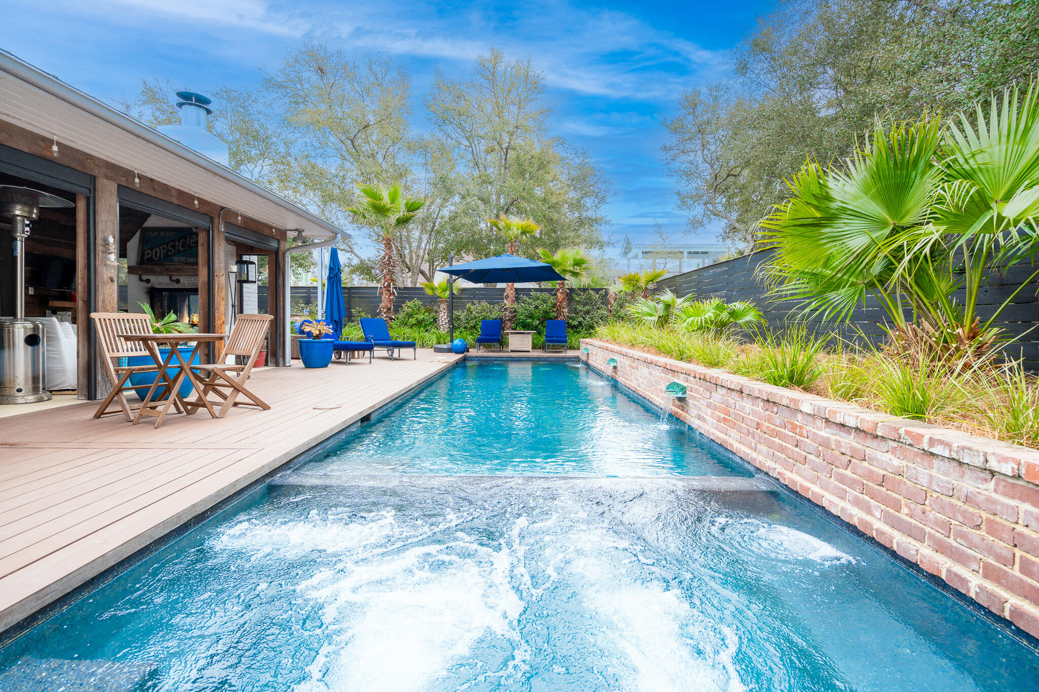 102 Camp Creek Road South Inlet Beach, FL 32461 - Photo 50 of 73 a view of a swimming pool with a patio