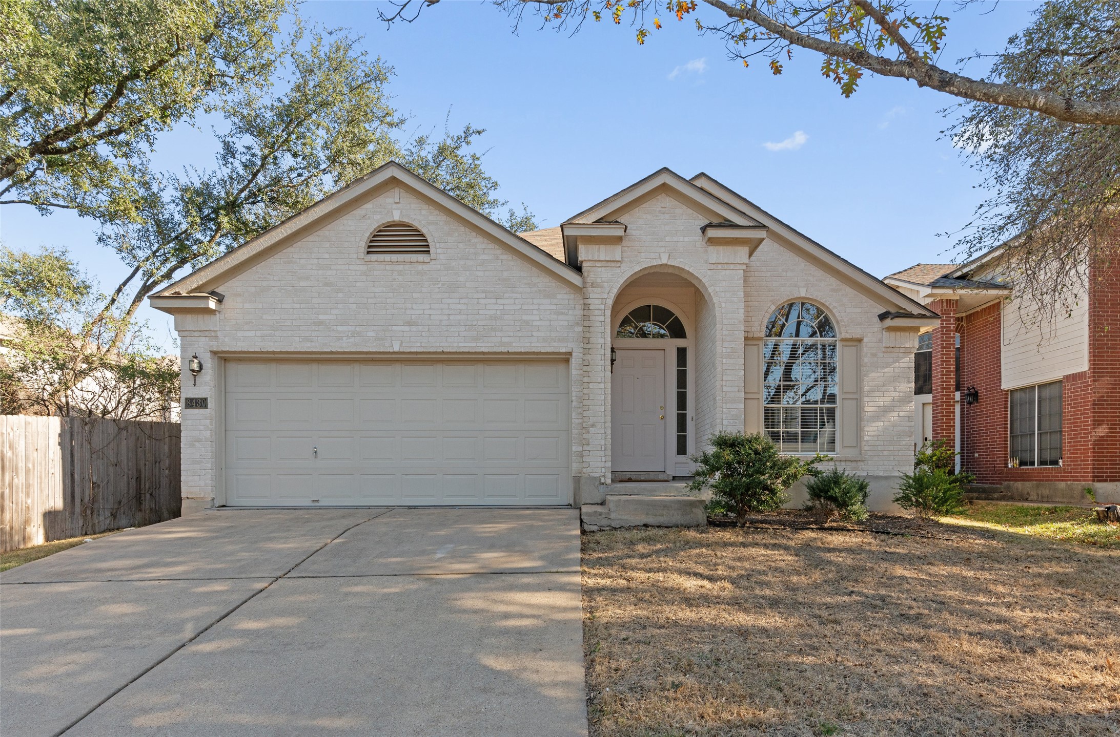 a view of a house with a yard and garage