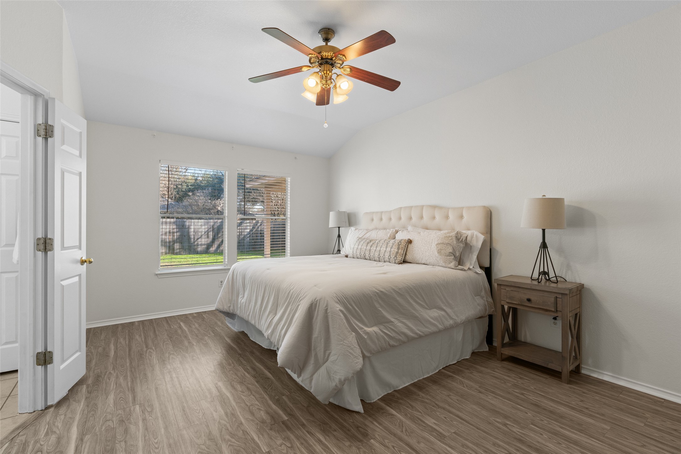 8430 Alvin High Lane Austin, TX 78729 - Photo 15 of 31 a bedroom with a bed and a window