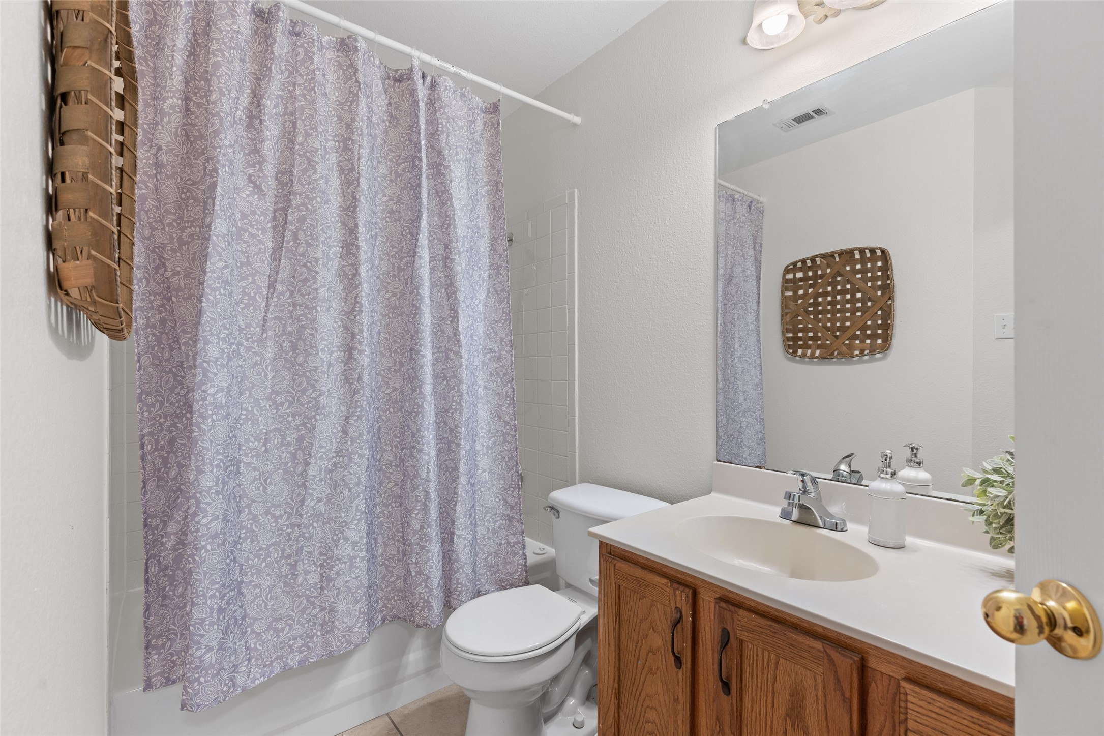 8430 Alvin High Lane Austin, TX 78729 - Photo 20 of 31 a bathroom with a sink a toilet and a mirror