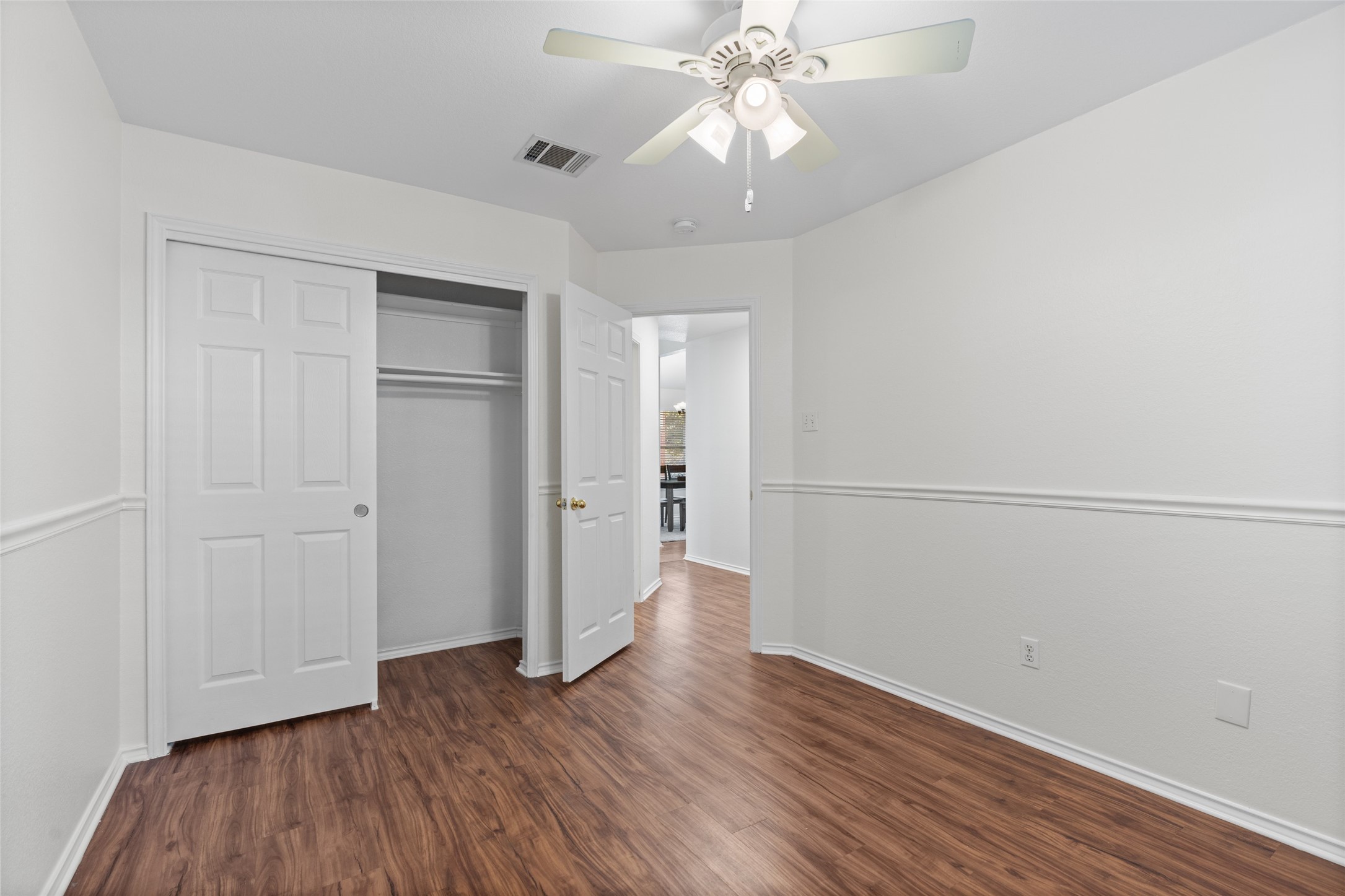 8430 Alvin High Lane Austin, TX 78729 - Photo 22 of 31 wooden floor in an empty room with a window