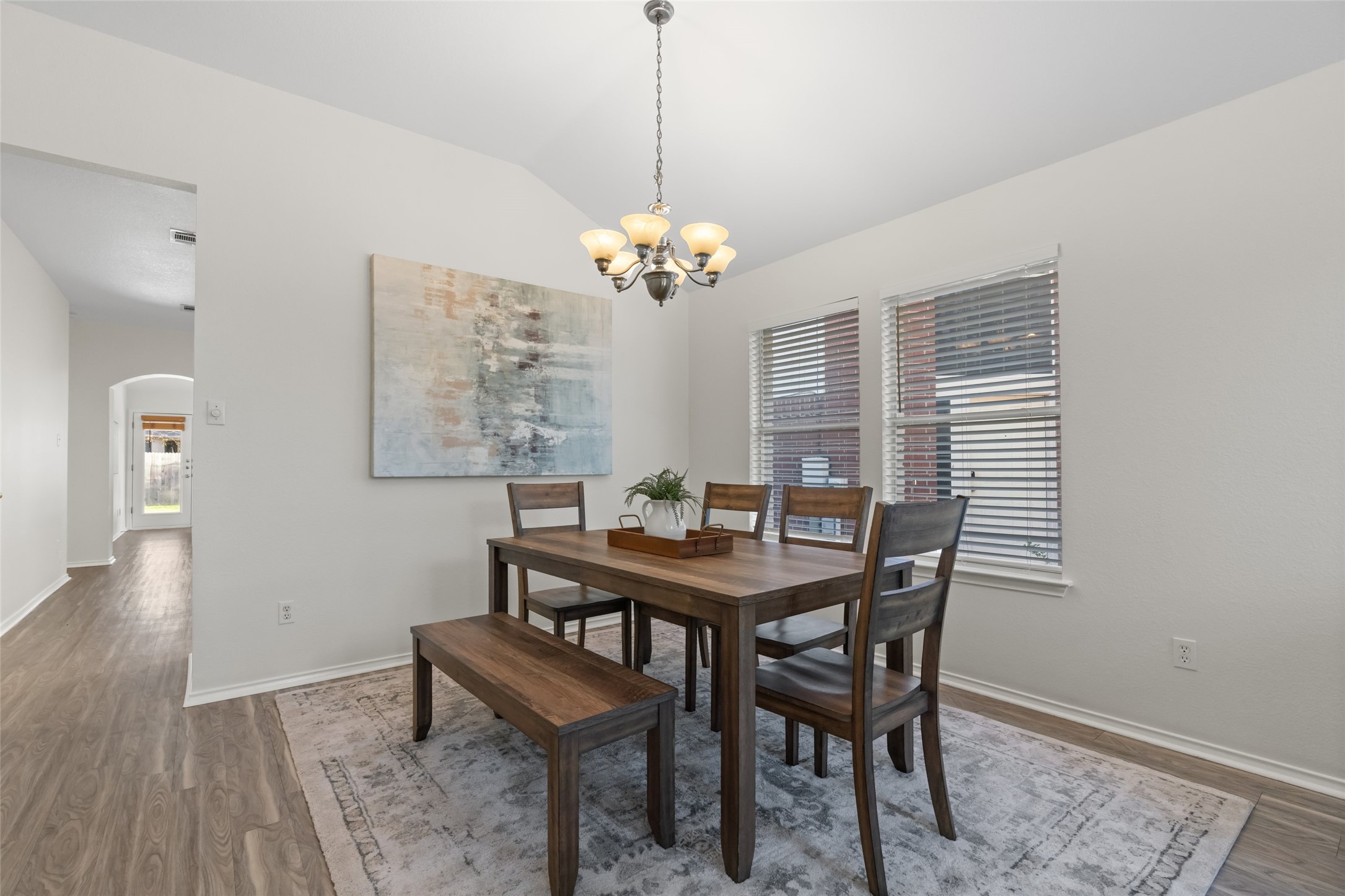 8430 Alvin High Lane Austin, TX 78729 - Photo 6 of 31 a view of a dining room with furniture window and wooden floor