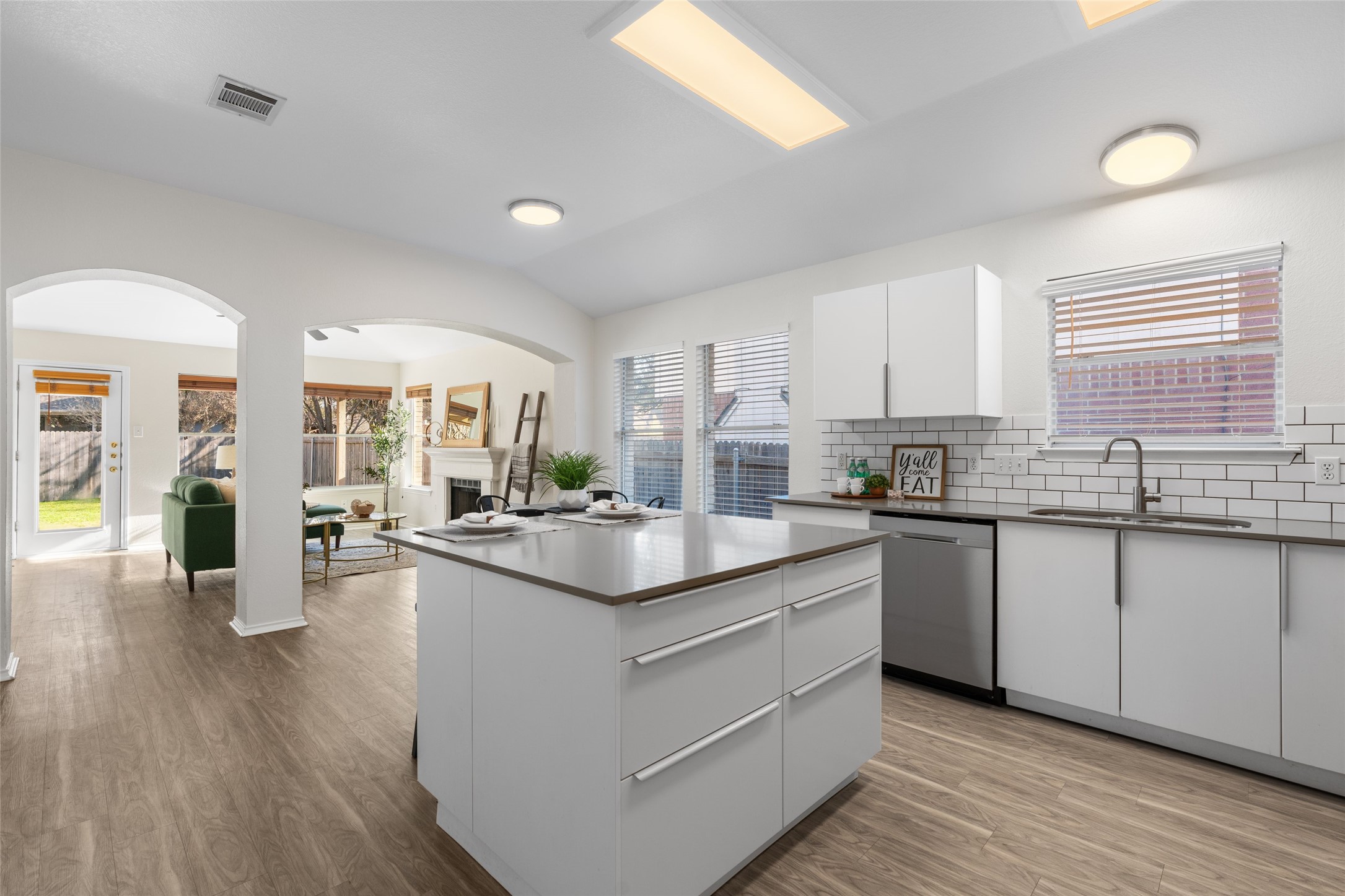 8430 Alvin High Lane Austin, TX 78729 - Photo 9 of 31 a kitchen with counter top space and wooden floor