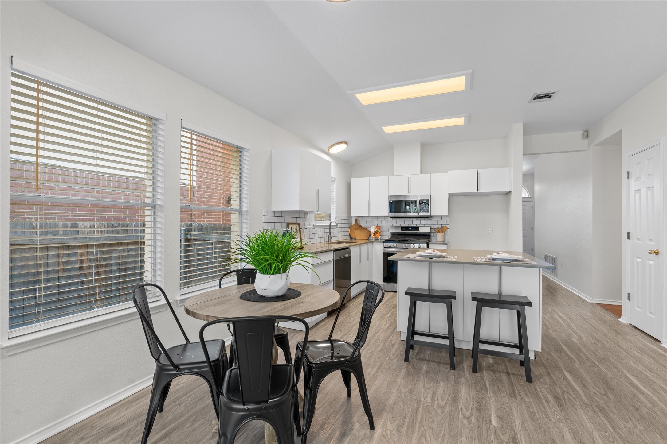 8430 Alvin High Lane Austin, TX 78729 - Photo 10 of 31 a view of a dining room with furniture and wooden floor