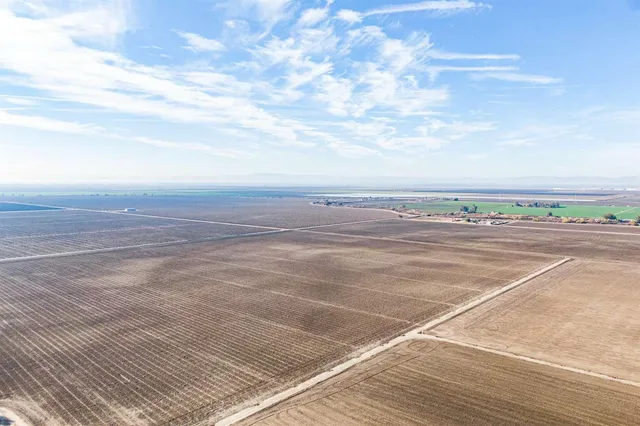 a view of a tennis court with an ocean
