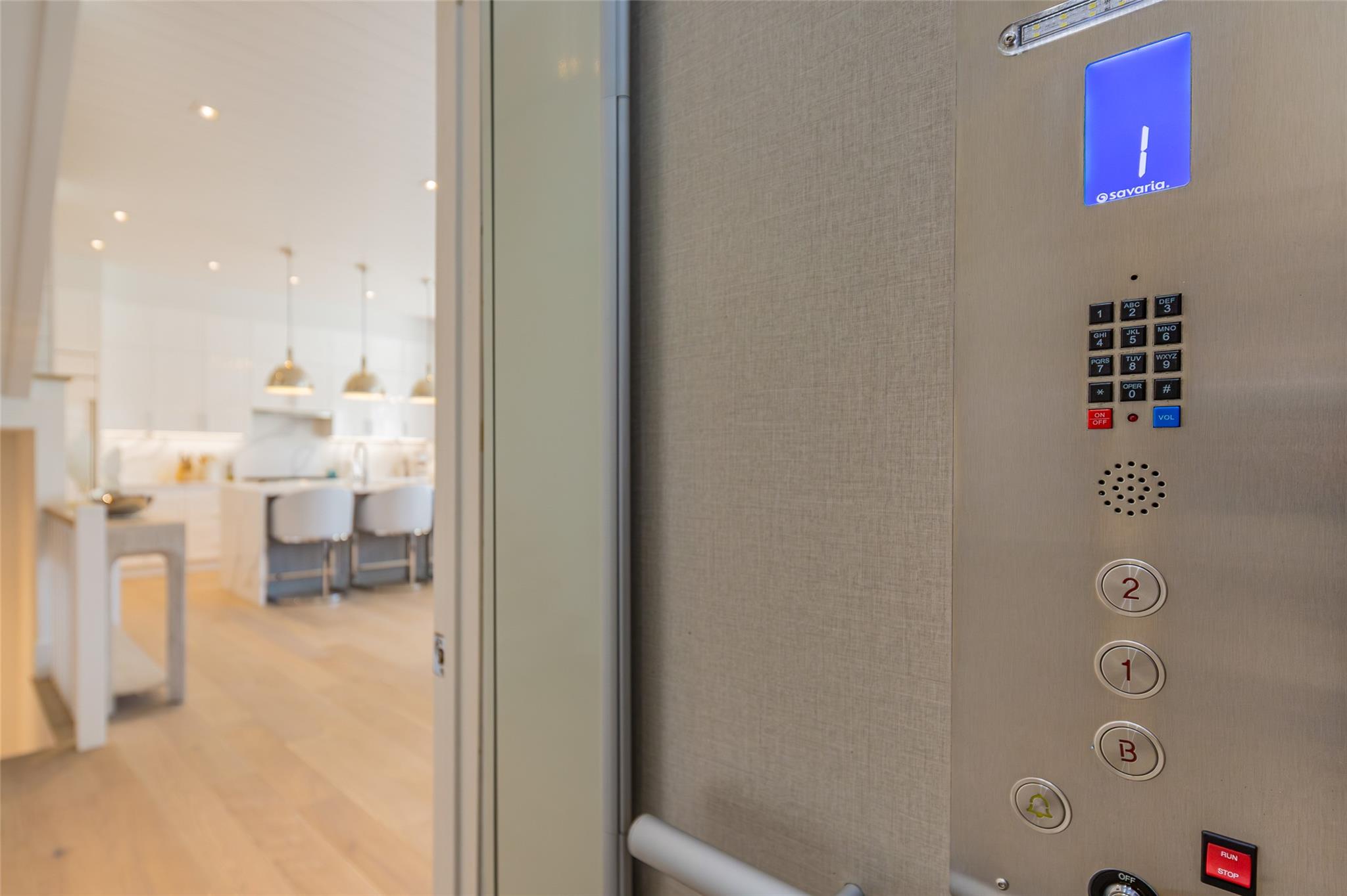 1 Spruce Court Water Mill, NY 11976 - Photo 11 of 35 Detailed view of wood finished floors, elevator, and recessed lighting