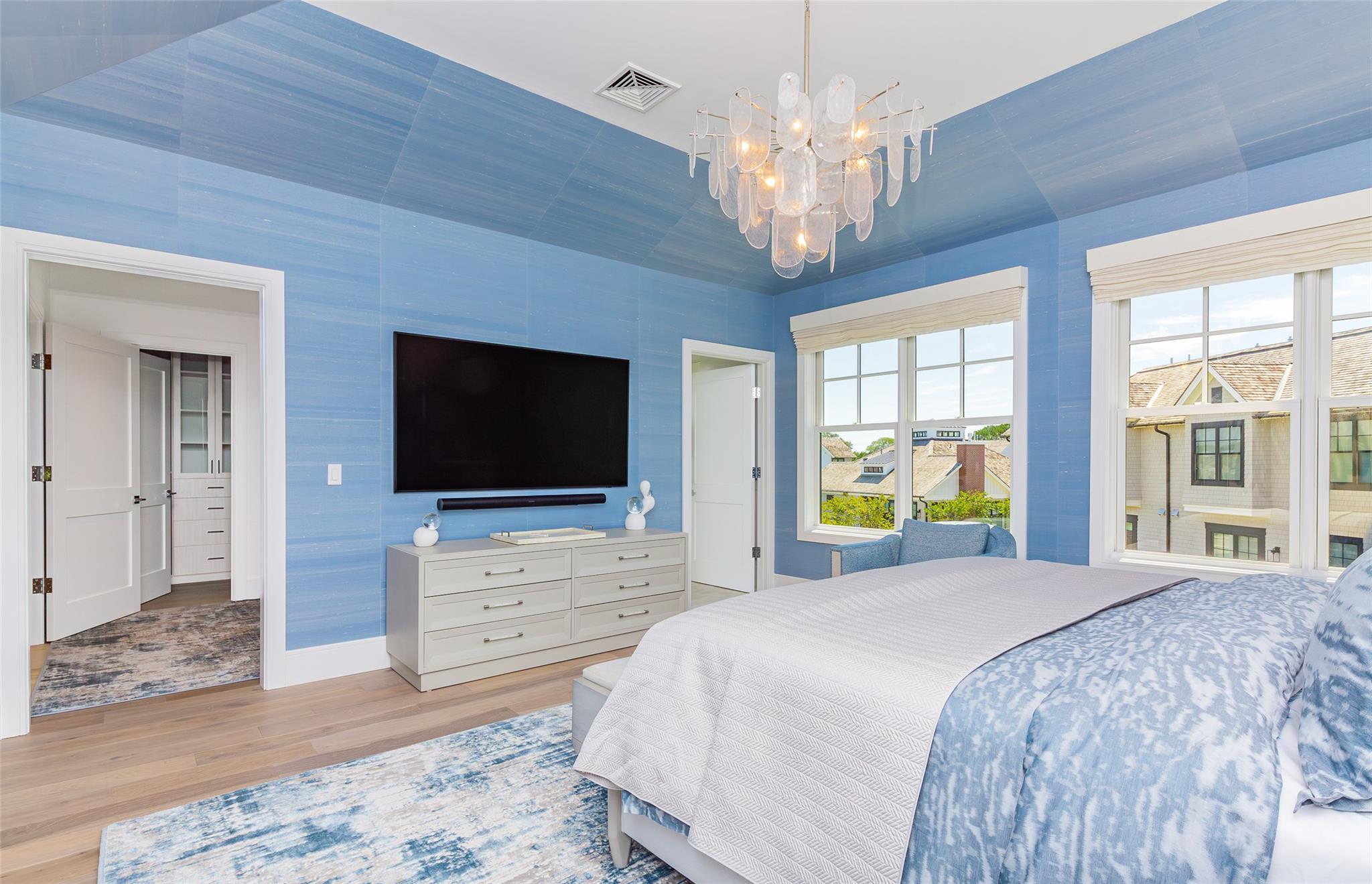 1 Spruce Court Water Mill, NY 11976 - Photo 16 of 35 Bedroom with a chandelier and wood finished floors