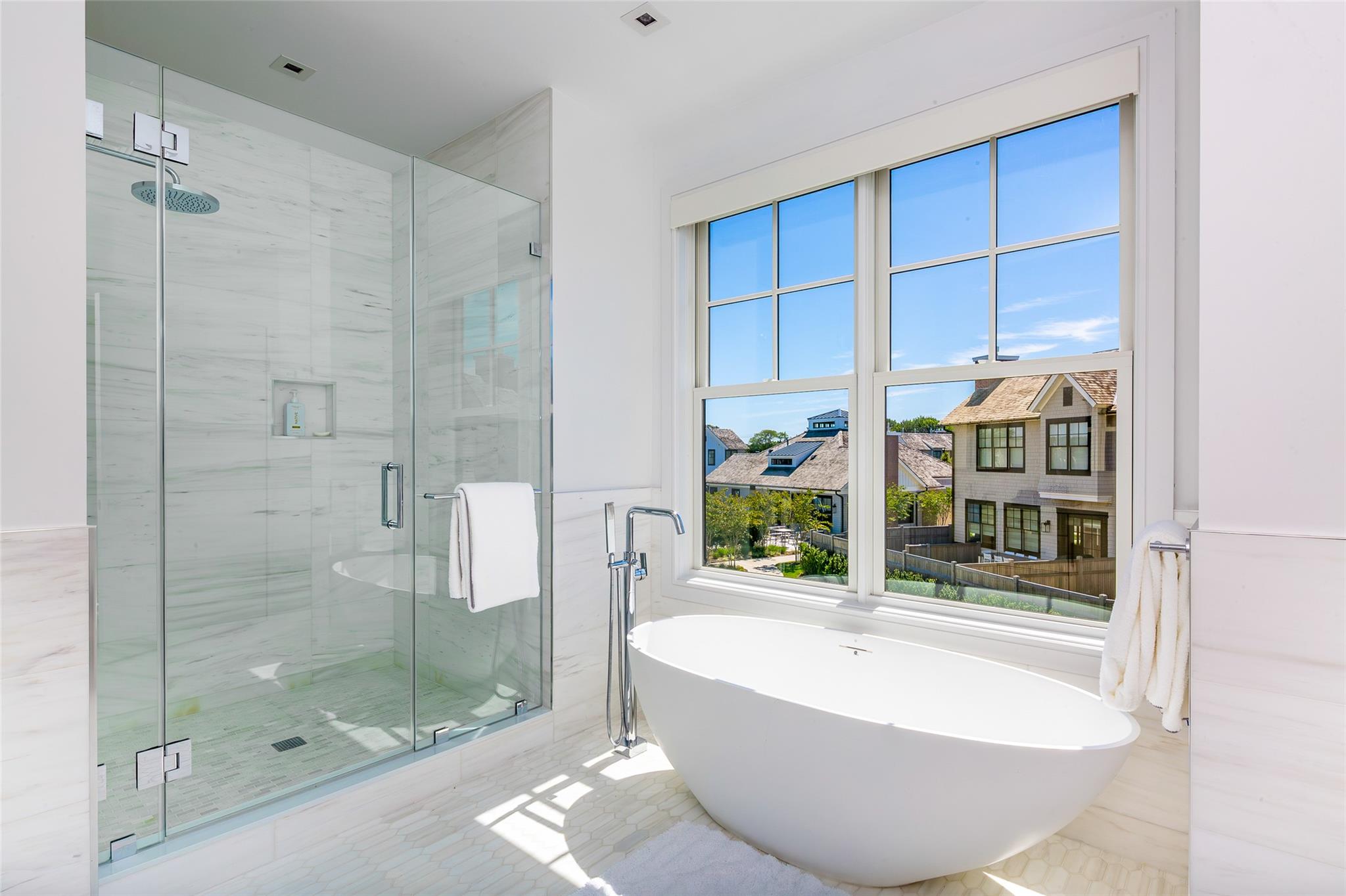 1 Spruce Court Water Mill, NY 11976 - Photo 18 of 35 Full bathroom featuring a freestanding tub, a wainscoted wall, a stall shower, and tile walls