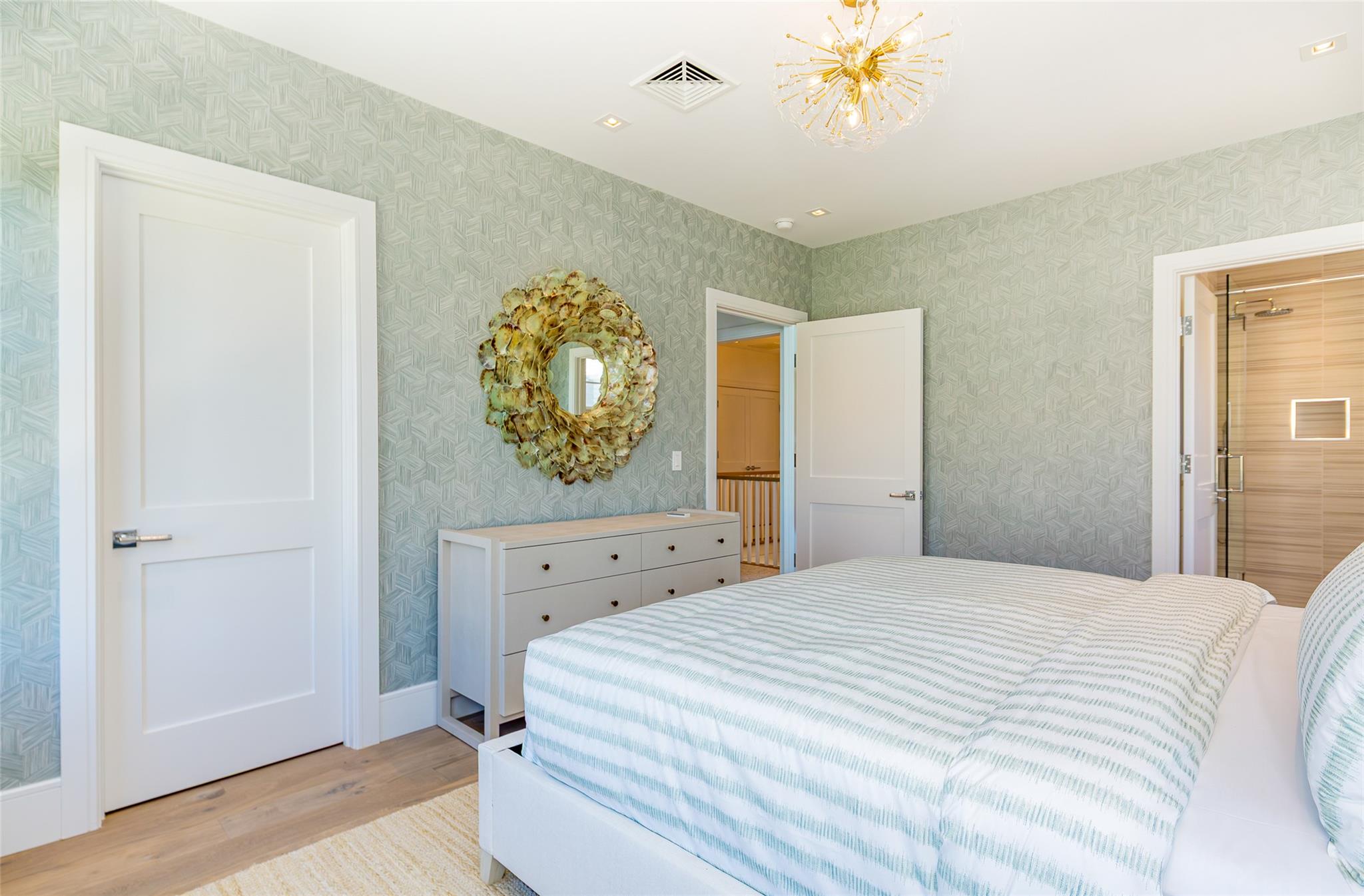 1 Spruce Court Water Mill, NY 11976 - Photo 24 of 35 Bedroom featuring light wood-style flooring, wallpapered walls, and a chandelier