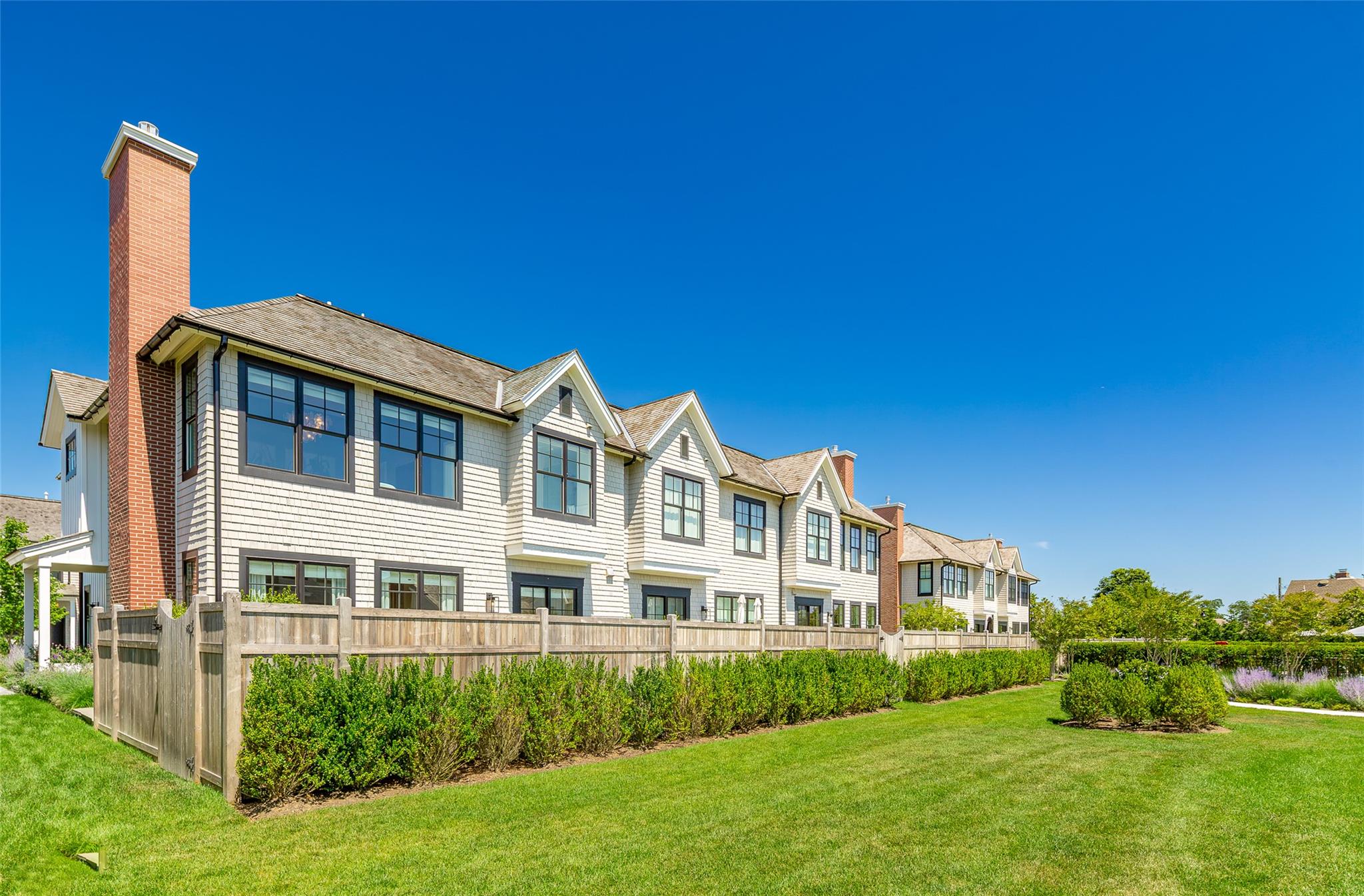 1 Spruce Court Water Mill, NY 11976 - Photo 30 of 35 Rear view of house featuring a residential view and a chimney