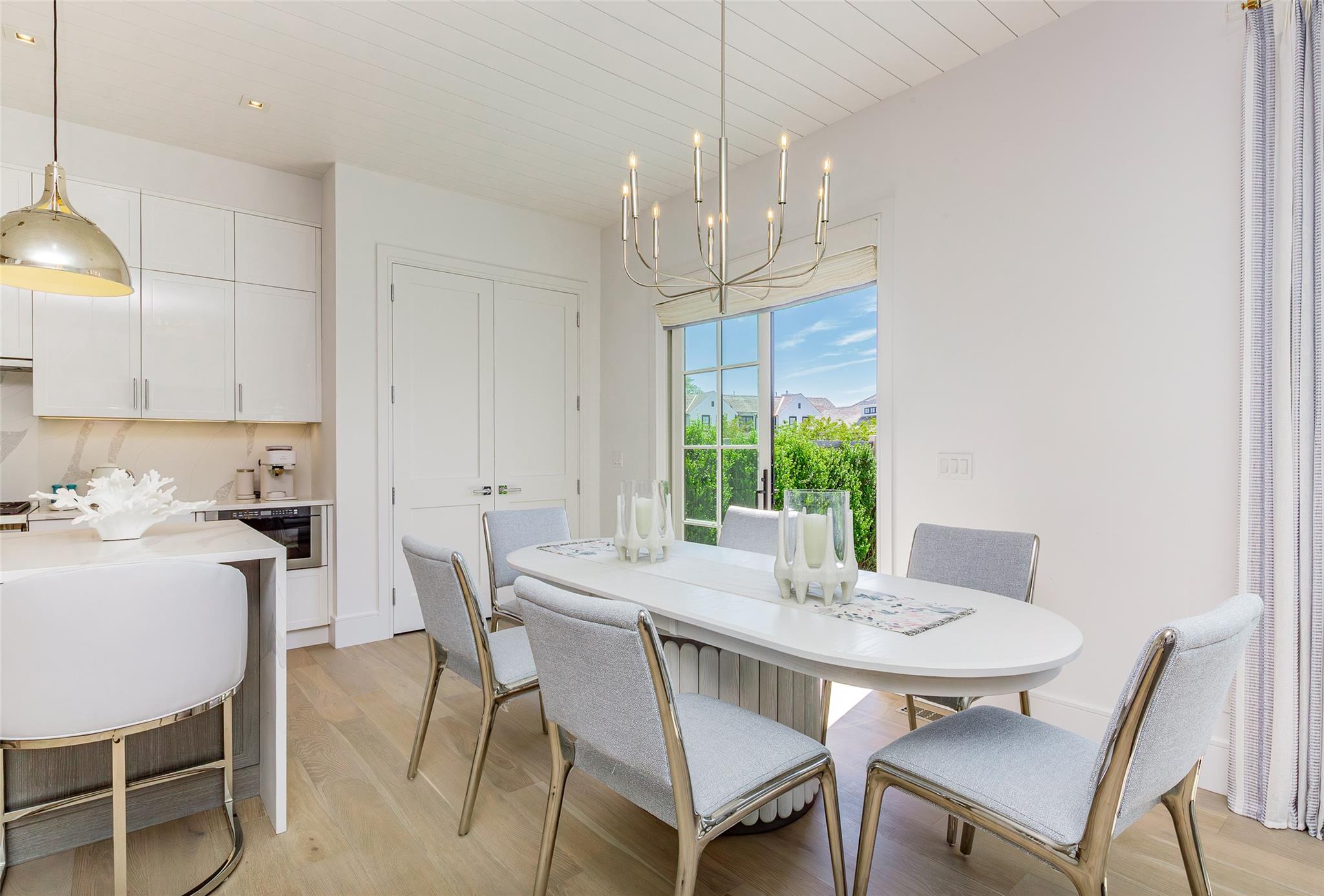 1 Spruce Court Water Mill, NY 11976 - Photo 8 of 35 Dining space with light wood-style flooring, a chandelier, and wood ceiling