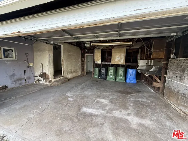 a view of a house with a yard and a garage