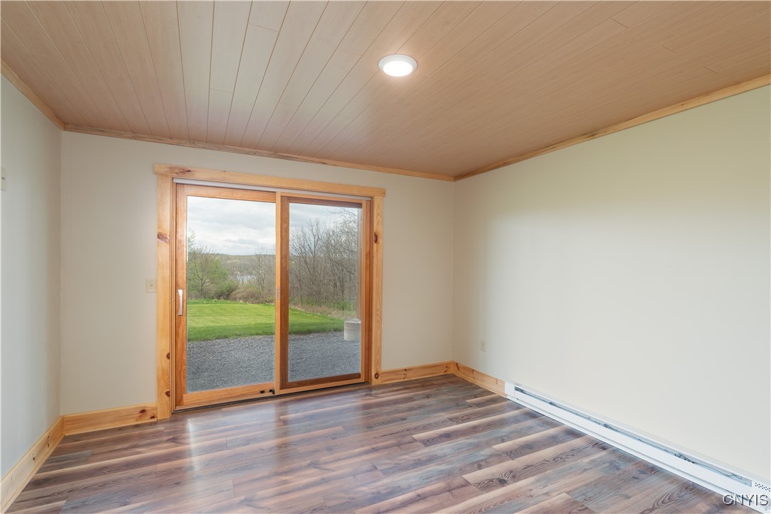 5689 Holmes Hill Road Conesus, NY 14435 - Photo 28 of 45 sliding door off Bedroom 2, opens to front yard.
