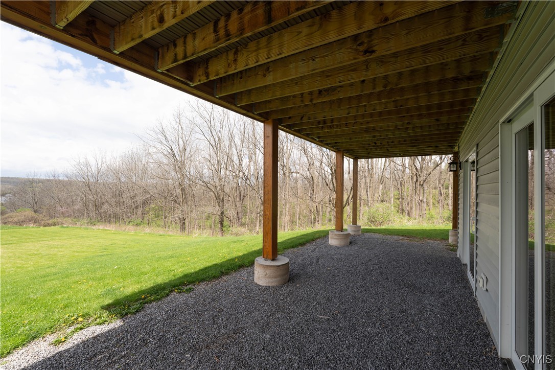 5689 Holmes Hill Road Conesus, NY 14435 - Photo 31 of 45 under deck area outside of bedroom 2 and 3
