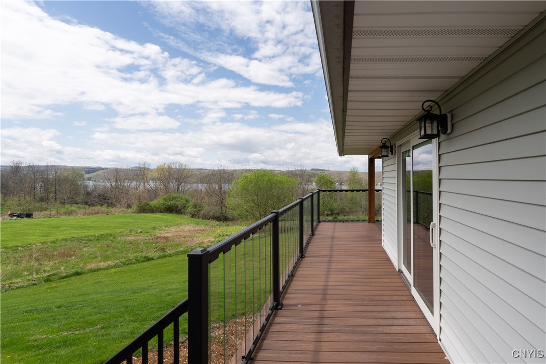 5689 Holmes Hill Road Conesus, NY 14435 - Photo 37 of 45 porch wrap around to side of house.