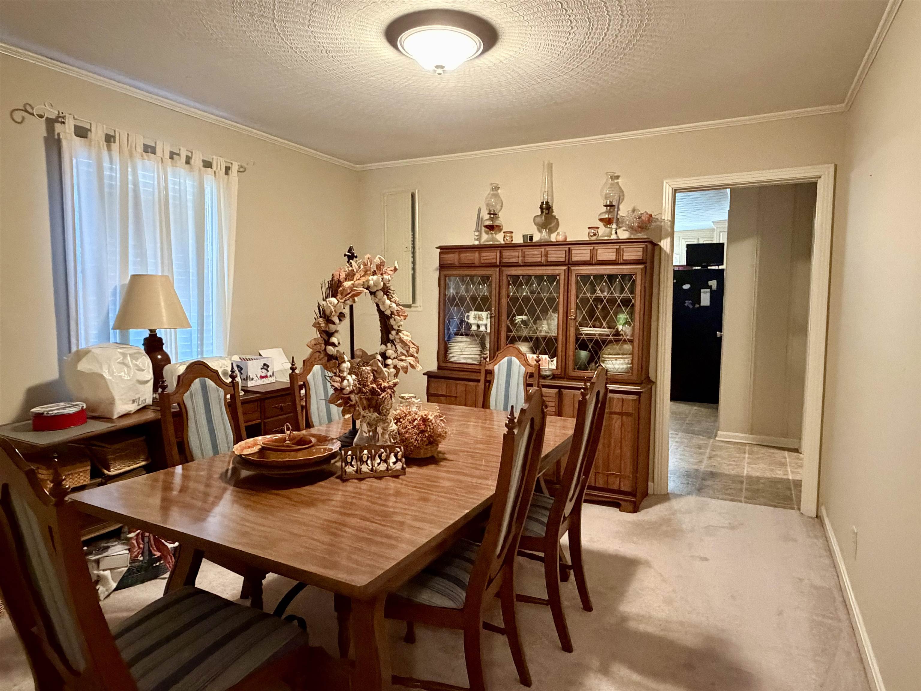 254 Michie Road Michie, TN 38357 - Photo 9 of 16 Dining room featuring light colored carpet and crown molding