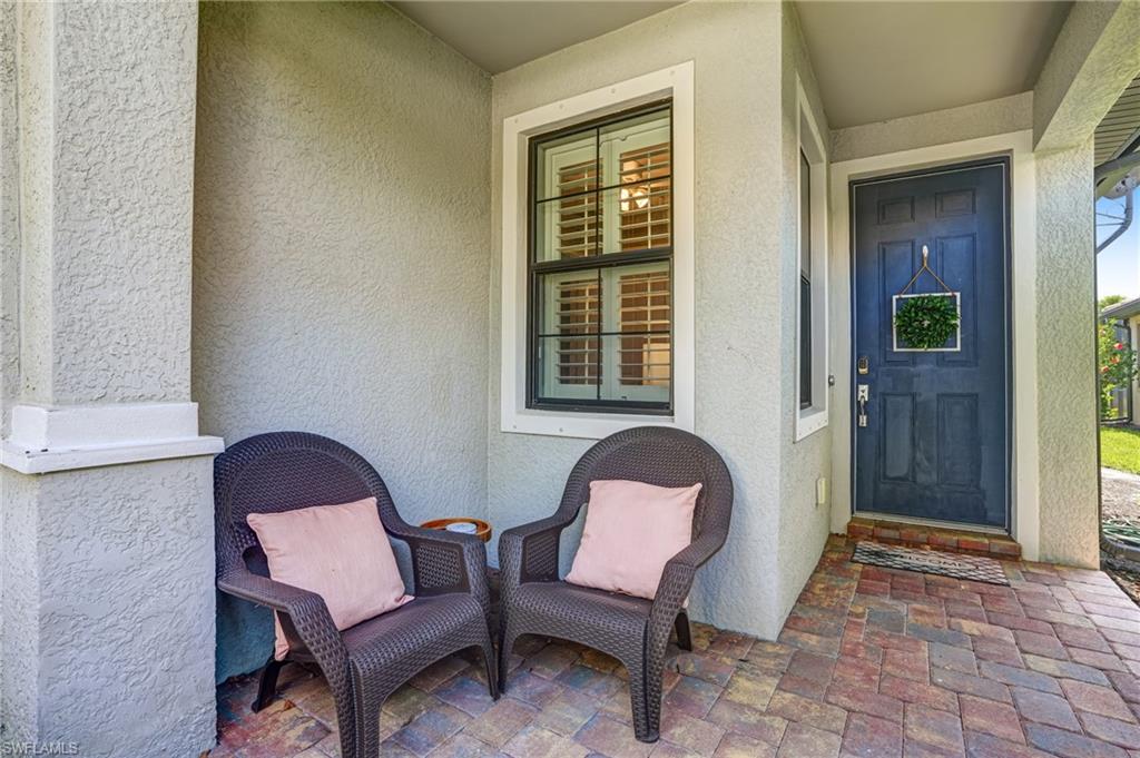 20308 Corkscrew Shores Boulevard Estero, FL 33928 - Photo 2 of 47 Entrance to property with stucco siding