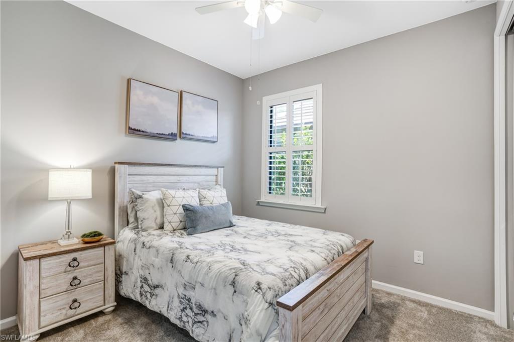 20308 Corkscrew Shores Boulevard Estero, FL 33928 - Photo 21 of 47 Carpeted bedroom with baseboards and ceiling fan