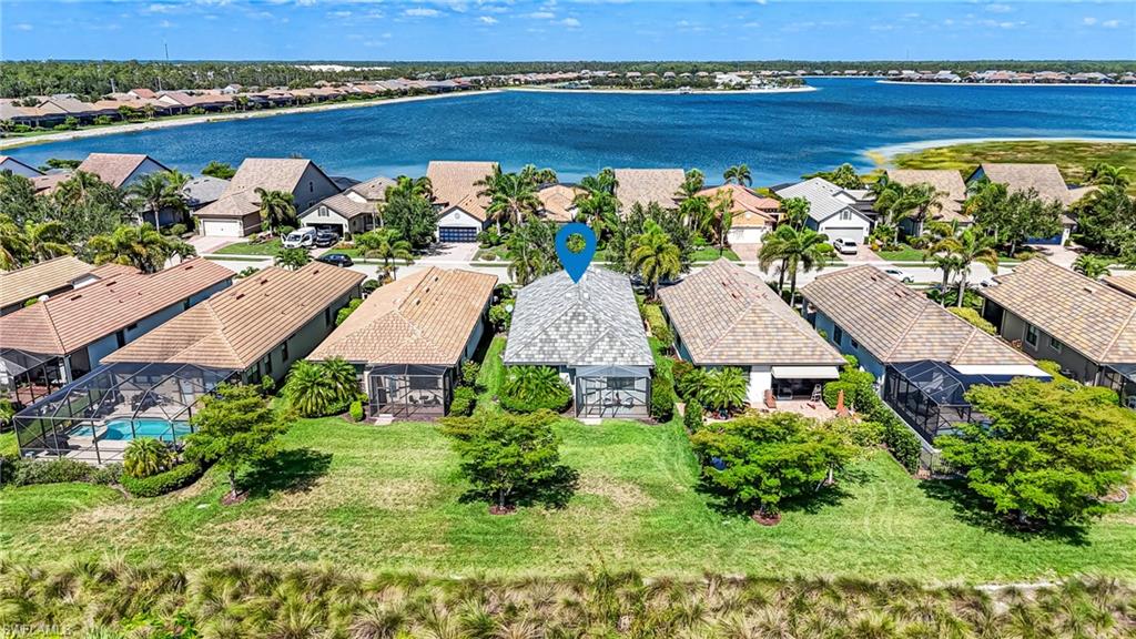 20308 Corkscrew Shores Boulevard Estero, FL 33928 - Photo 33 of 47 Aerial view of residential area featuring a large body of water