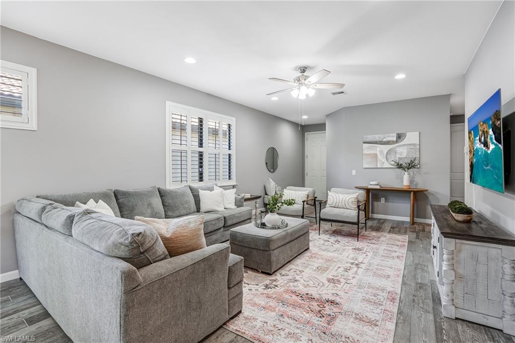 20308 Corkscrew Shores Boulevard Estero, FL 33928 - Photo 4 of 47 Living area with ceiling fan, wood finished floors, plenty of natural light, recessed lighting, and baseboards