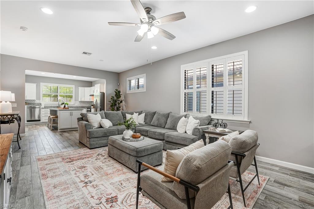 20308 Corkscrew Shores Boulevard Estero, FL 33928 - Photo 6 of 47 Living room with healthy amount of natural light, recessed lighting, light wood-style flooring, and ceiling fan