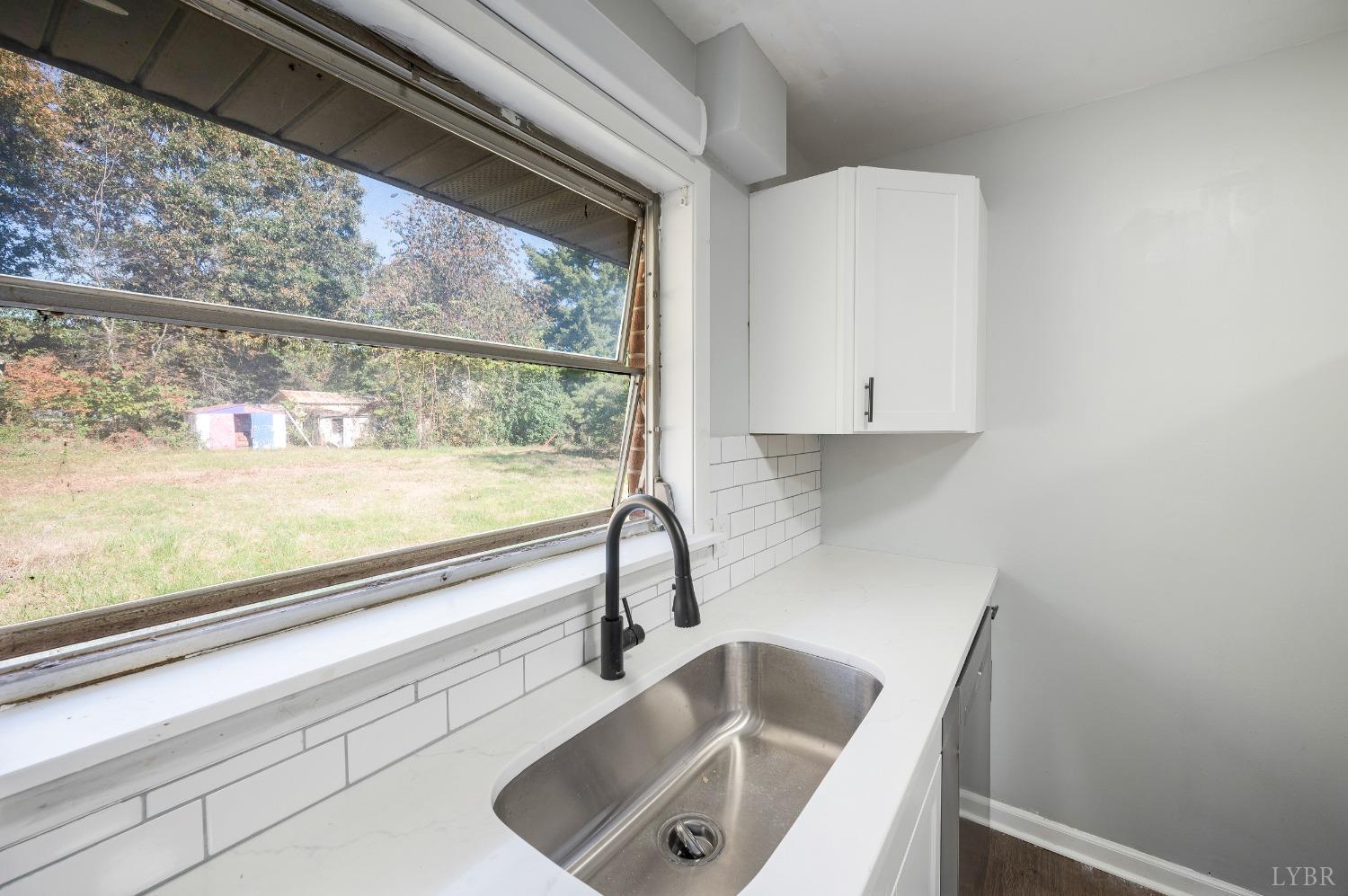 109 Hillside Road Hurt, VA 24563 - Photo 11 of 42 a sink sitting next to a window