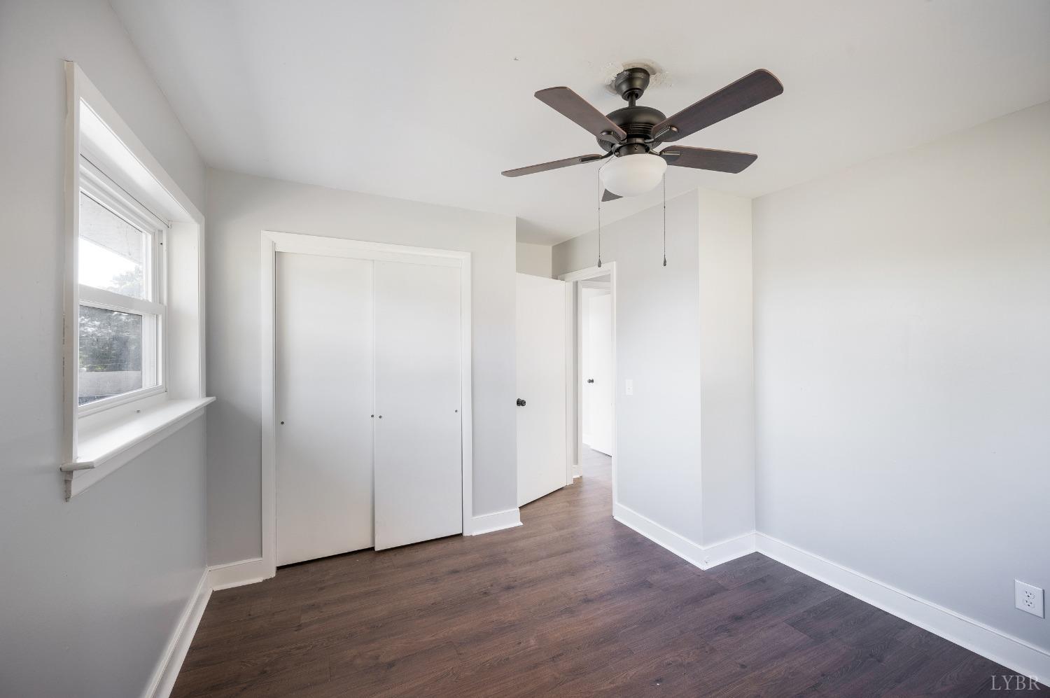 109 Hillside Road Hurt, VA 24563 - Photo 17 of 42 a view of a room with wooden floor and a ceiling fan