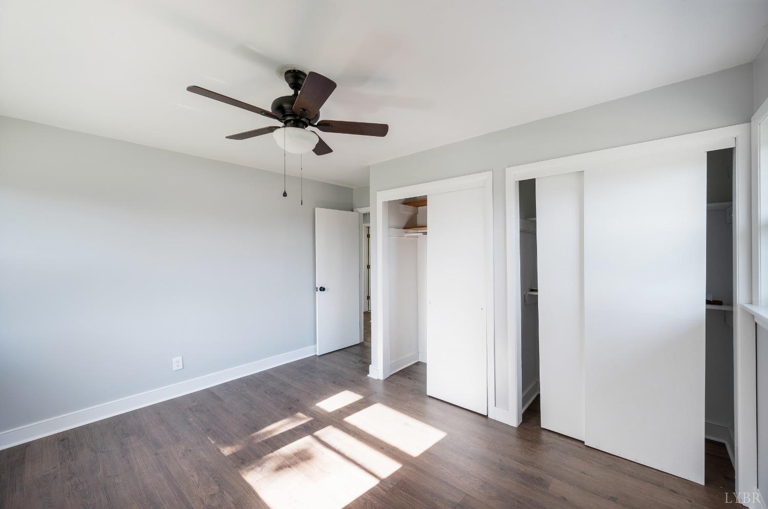 109 Hillside Road Hurt, VA 24563 - Photo 19 of 42 a view of a room with wooden floor and ceiling fan
