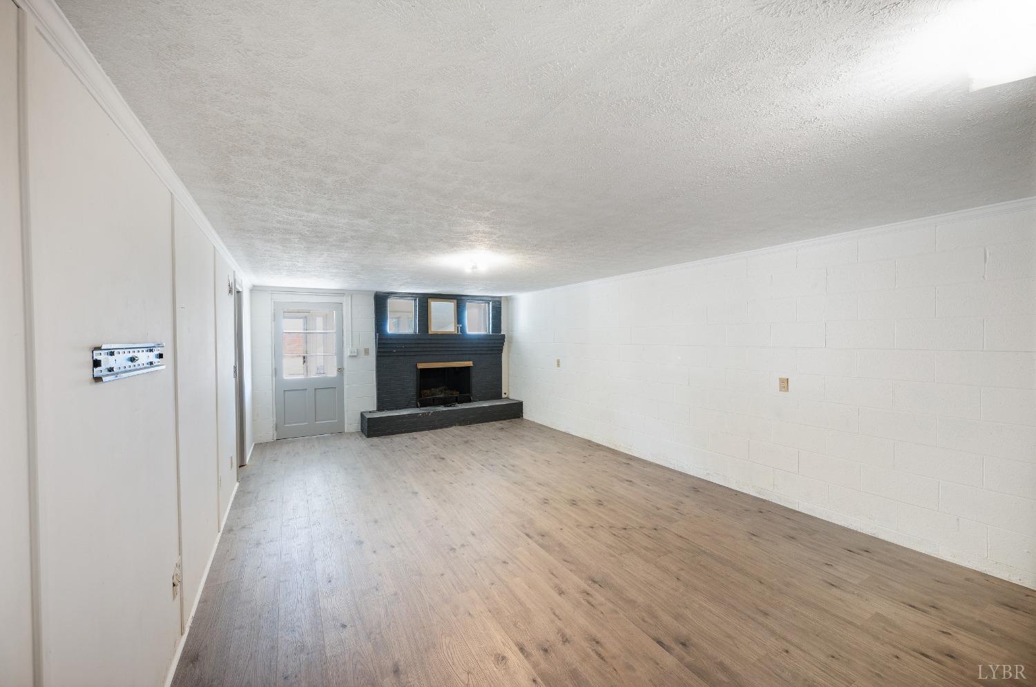 109 Hillside Road Hurt, VA 24563 - Photo 23 of 42 a view of empty room with wooden floor