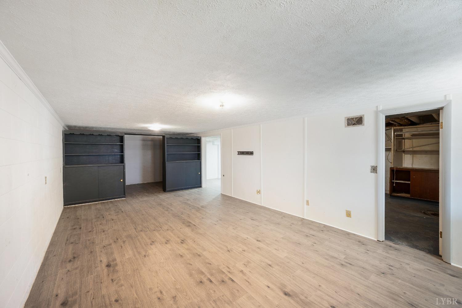 109 Hillside Road Hurt, VA 24563 - Photo 24 of 42 a view of empty room with wooden floor