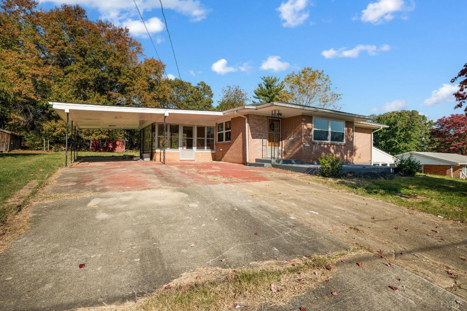 109 Hillside Road Hurt, VA 24563 - Photo 30 of 42 a front view of a house with a yard and potted plants