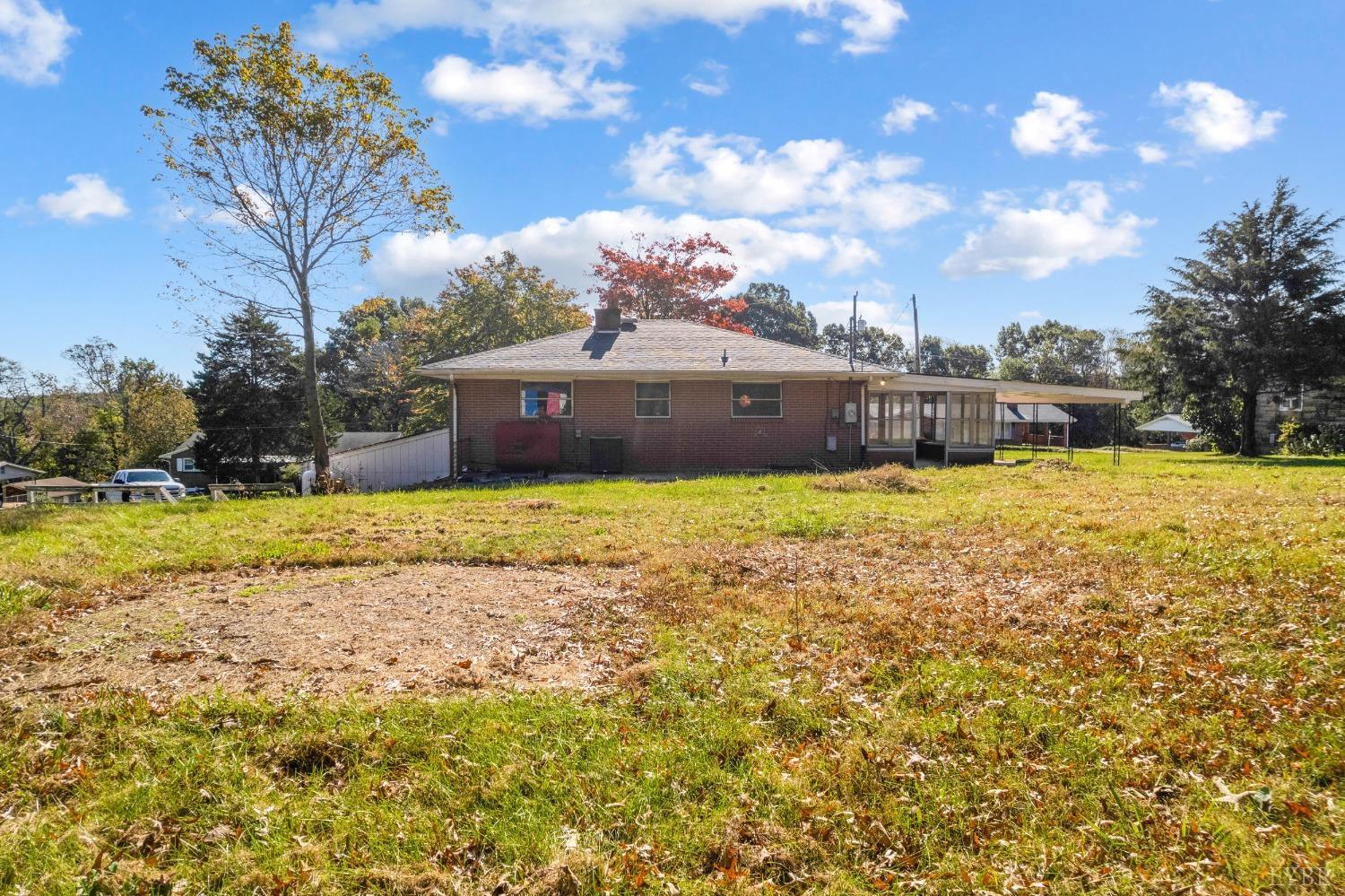 109 Hillside Road Hurt, VA 24563 - Photo 31 of 42 a view of a lake with a house in the background