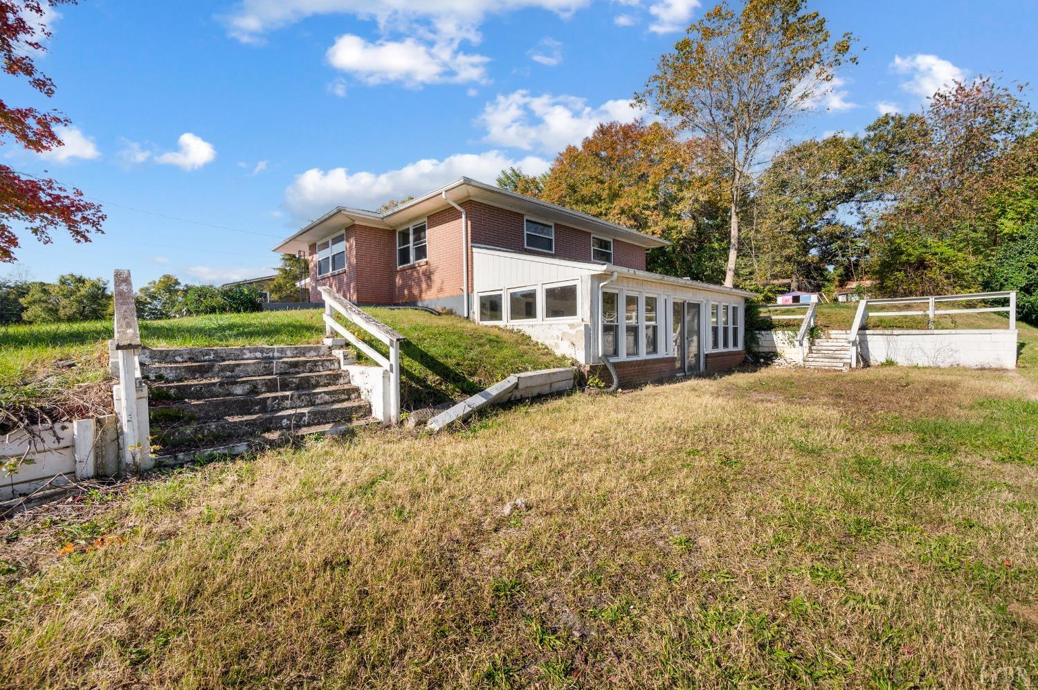 109 Hillside Road Hurt, VA 24563 - Photo 34 of 42 a view of a house with a large tree and a yard