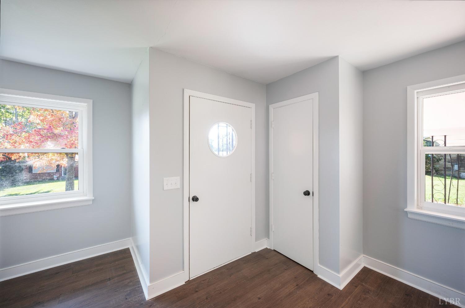 109 Hillside Road Hurt, VA 24563 - Photo 4 of 42 a view of an empty room with wooden floor and a window