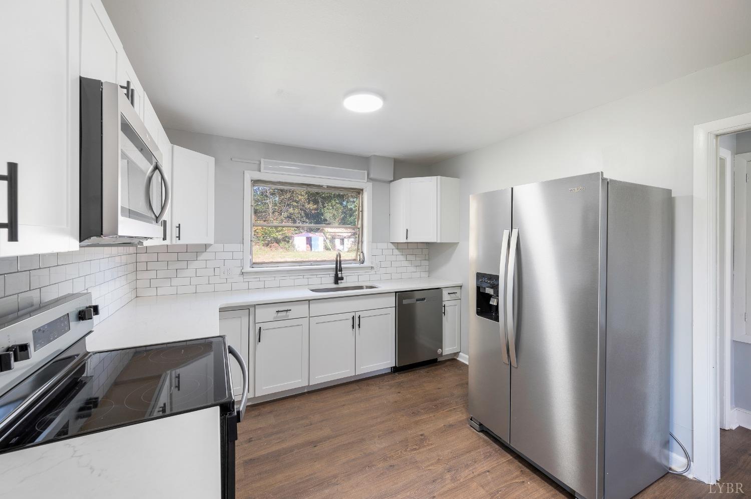 109 Hillside Road Hurt, VA 24563 - Photo 7 of 42 a kitchen with a refrigerator stove and sink