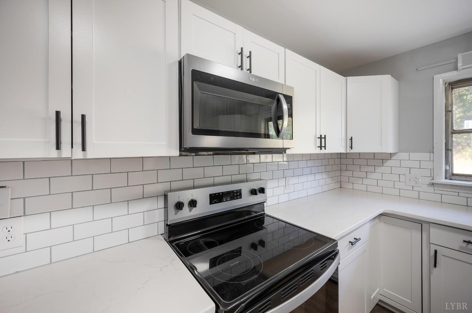 109 Hillside Road Hurt, VA 24563 - Photo 8 of 42 a kitchen with microwave cabinets and a stove top oven