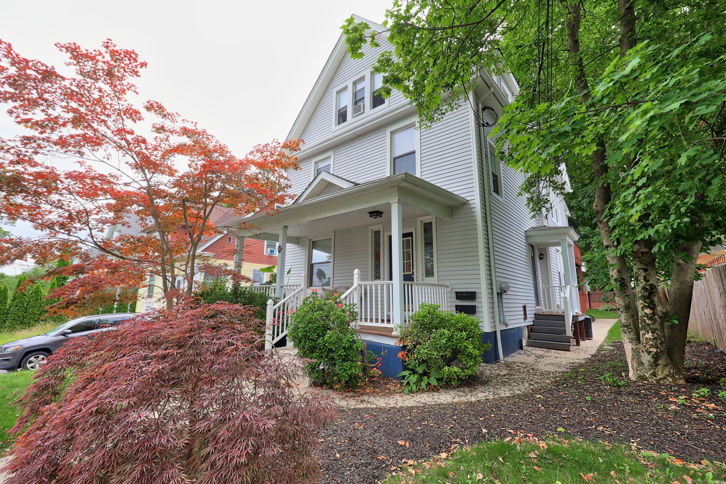 front view of a house with a garden