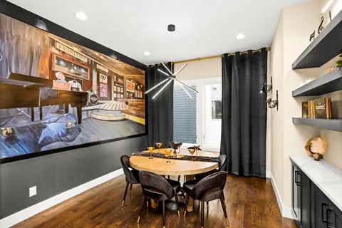 a dinning table and chairs in a kitchen