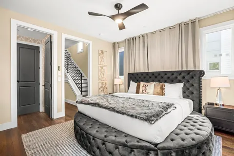 a bedroom with a bed and a dresser