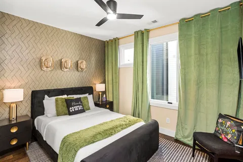 a bedroom with a bed and window