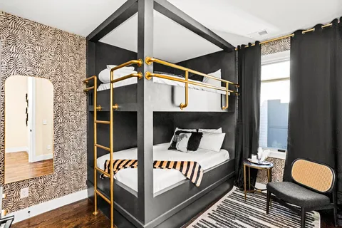 a bedroom with bed and a window